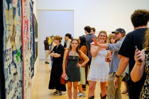 Students stroll through the senior studio art show.