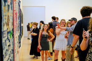 Students stroll through the senior studio art show.