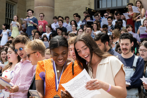 Senior sing on the steps of Rosse Hall