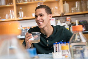 David Anderson with mosquitoes in lab