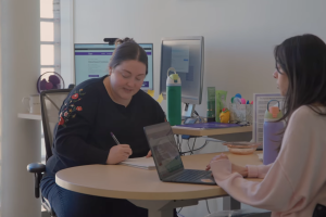 Student chatting with professor