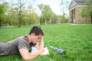 Student reading outside