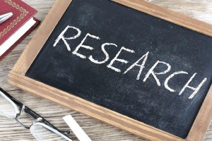 Research written on a chalkboard