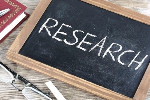 Research written on a blackboard