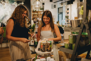 Alexandra Hofacre ’27, left, and Catelin Bromfield ’26, taking part in a photo shoot for a client during their time as interns for Milestone Marketing in Columbus this past summer. (Courtesy of Kristen Orlando-Ricordati ’05)