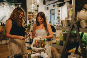 Alexandra Hofacre ’27, left, and Catelin Bromfield ’26, taking part in a photo shoot for a client during their time as interns for Milestone Marketing in Columbus this past summer. (Courtesy of Kristen Orlando-Ricordati ’05)