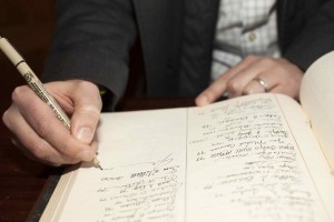 John Green ’00 H’16 signs the Matriculation Book