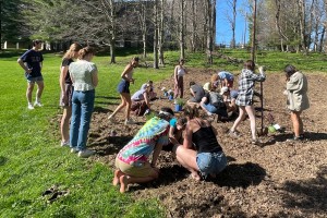 Students gathered Monday to plant a pollinator garden behind Gund Commons. Photo courtesy of Isabel Braun ’26.