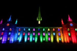 Old Kenyon residence hall lit in rainbow colors