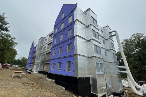 One of two apartment-style residence halls on South Campus that continued to take shape this summer.