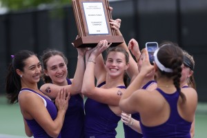 Members of the women's tennis team after winning the NCAC tournament.