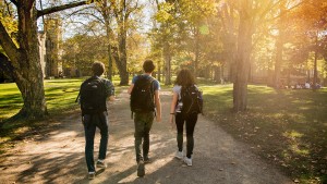 Three students walking down Middle Path