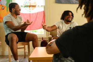 Kenyon students laughing and talking in a group setting