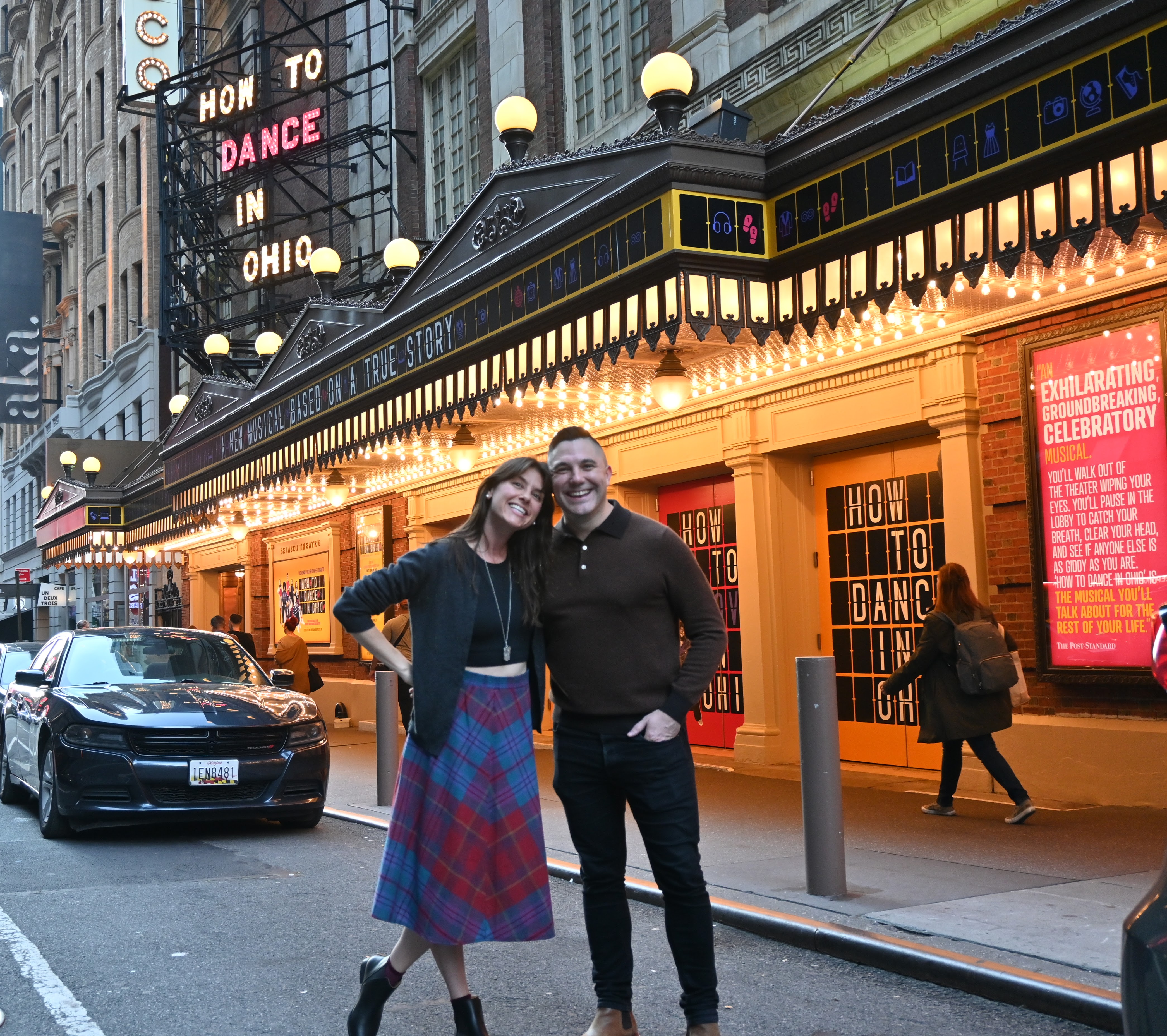 Jacob Yandura '09 with his songwriting partner Rebekah Greer Melocik in front of the marquee for "How to Dance in Ohio."