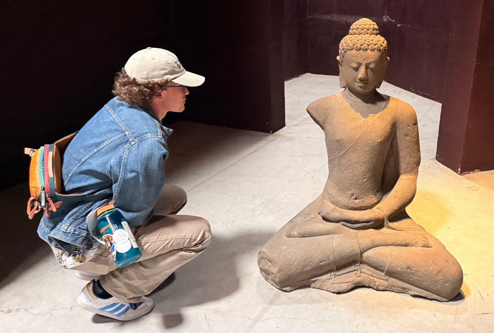 Student looking at statue
